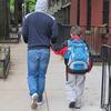 parent walking child to school